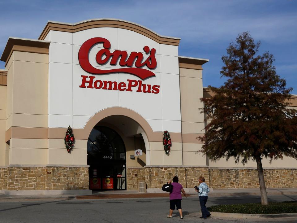 Shoppers in front of a Conn's Home Plus store in Texas