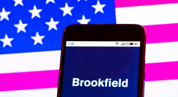 The Brookfield Renewable Partners (BEP) logo is displayed on a smartphone screen in front of a digital American flag background.