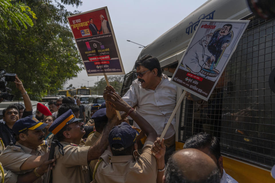 Police detain members of opposition Congress party who were demanding an investigation into allegations of fraud and stock manipulation by India's Adani Group outside National Stock Exchange during a protest in Mumbai, India, Wednesday, March 1, 2023. The Adani Group suffered a massive sell-off of its shares after a U.S.-based short-selling firm, Hindenburg Research, accused it of various fraudulent practices. The Adani Group has denied any wrongdoing. (AP Photo/Rafiq Maqbool)