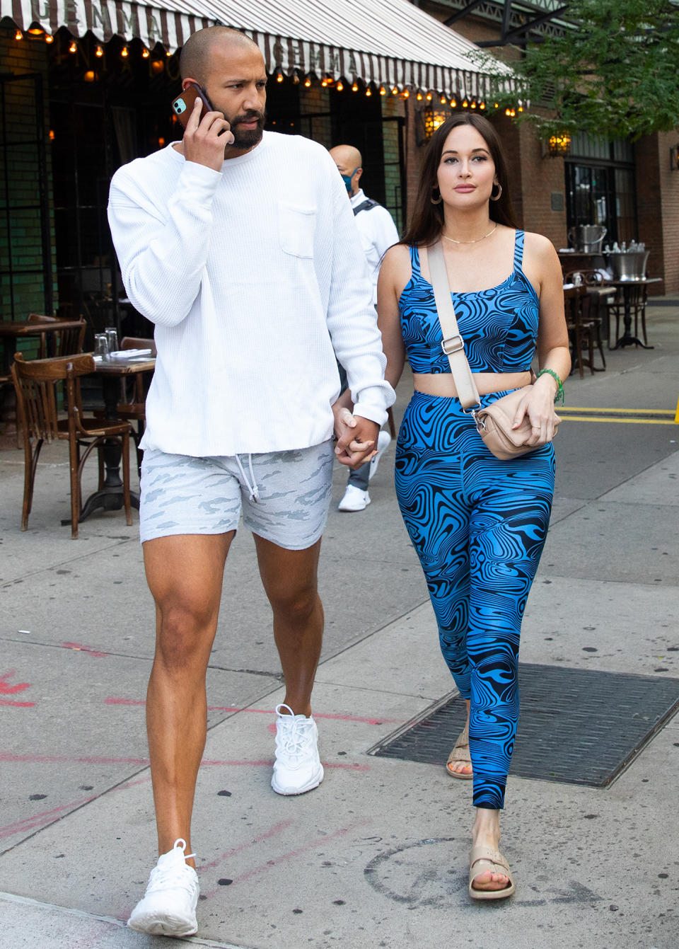 <p>Kacey Musgraves and rumored new boyfriend Cole Schafer stroll hand-in-hand through N.Y.C. on June 20.</p>