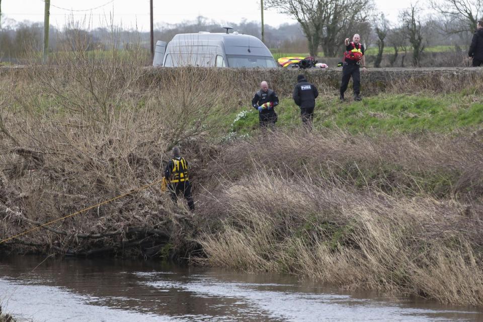 A police diving team at the River Wyre near St Michael’s on Wyre, Lancashire (PA Wire)