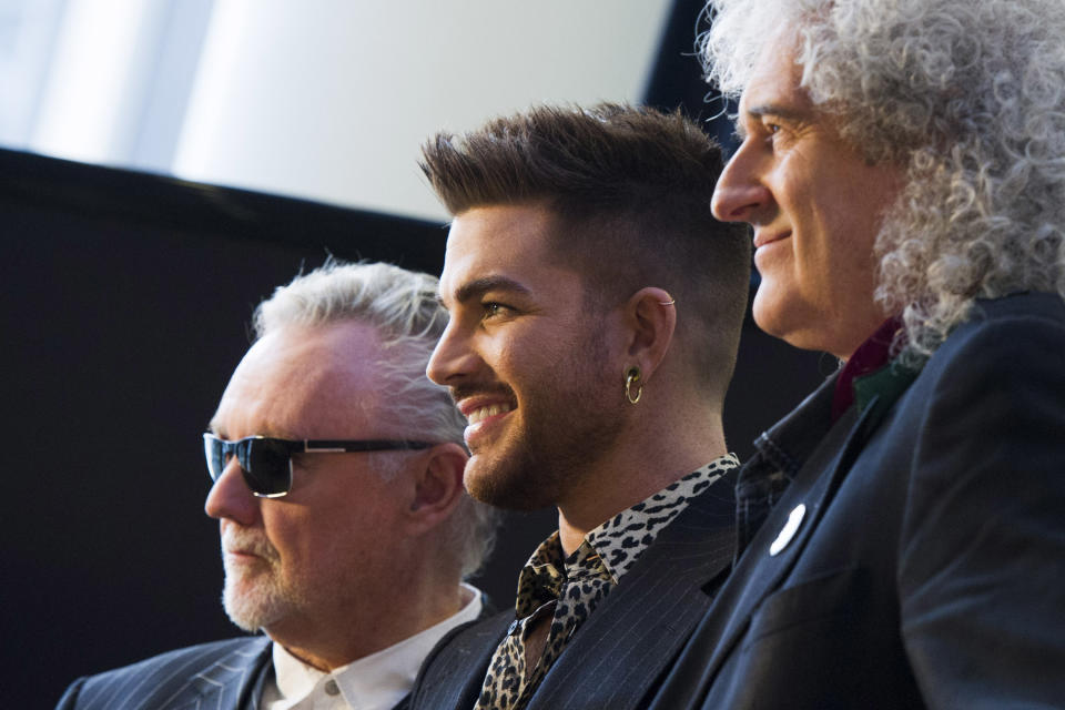 From left, Roger Taylor, Adam Lambert and Brian May announce a Queen + Adam Lambert summer tour, on Thursday, March 6, 2014 in New York. (Photo by Charles Sykes/Invision/AP)