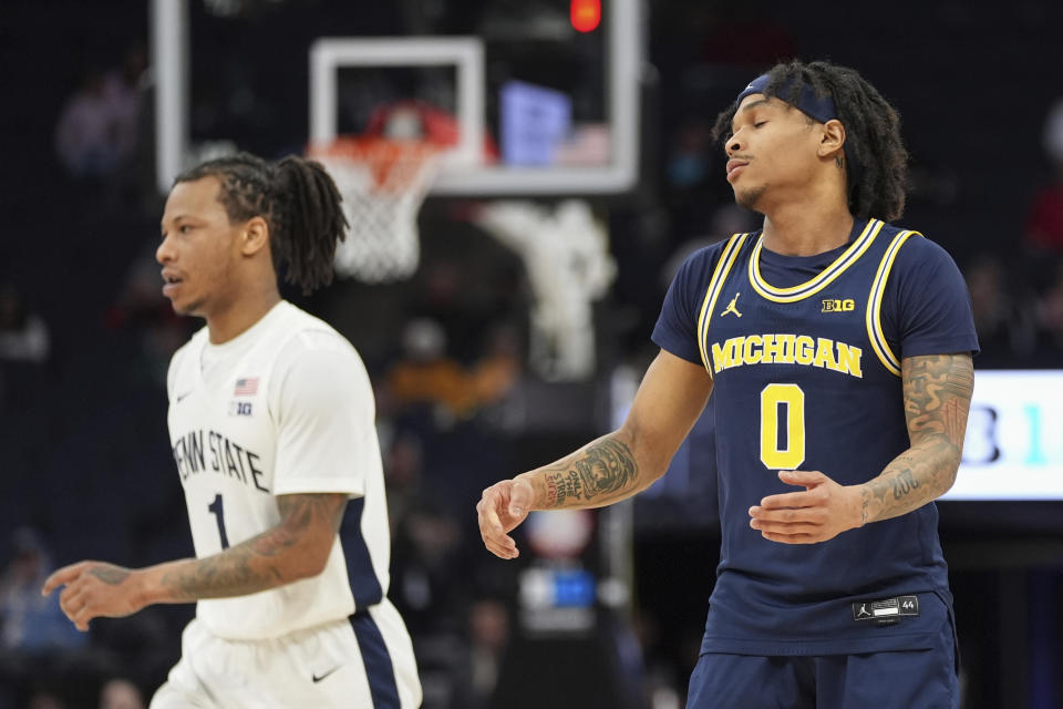Michigan guard Dug McDaniel (0) reacts after missing a shot against Penn State during the first half of an NCAA college basketball game in the first round of the Big Ten Conference men's tournament Wednesday, March 13, 2024, in Minneapolis. (AP Photo/Abbie Parr)
