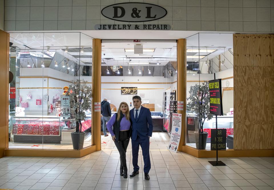 Daniel Figueroa and Laura Gutierrez fulfilled their dream of opening a jewelry business 20 years ago when they opened D&L Jewelry & Repair inside Lafayette Square Mall in Indianapolis. After moving from Mexico to Chicago, their family sometimes struggled to make ends meet. "We moved here to Indianapolis and we saw there was a way to make our dreams come true, and we worked hard to make it happen," Daniel said. "We worked day and night to try to achieve our dream." The couple is pictured Thursday, Jan. 27, 2022, outside their shop.