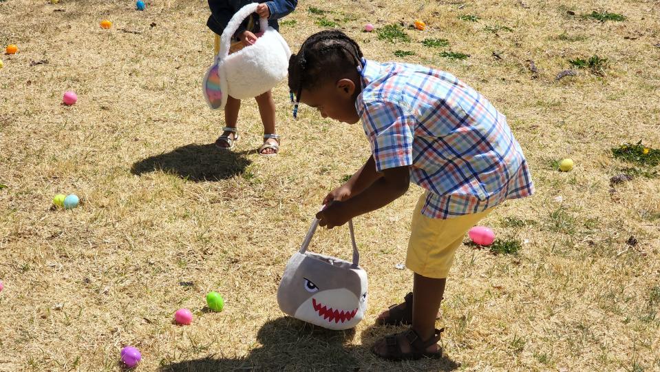 A young boy looks over eggs at Bones Hooks Park at the 2022 Shi Lee's Easter Egg Hunt. This year's event will be April 9.