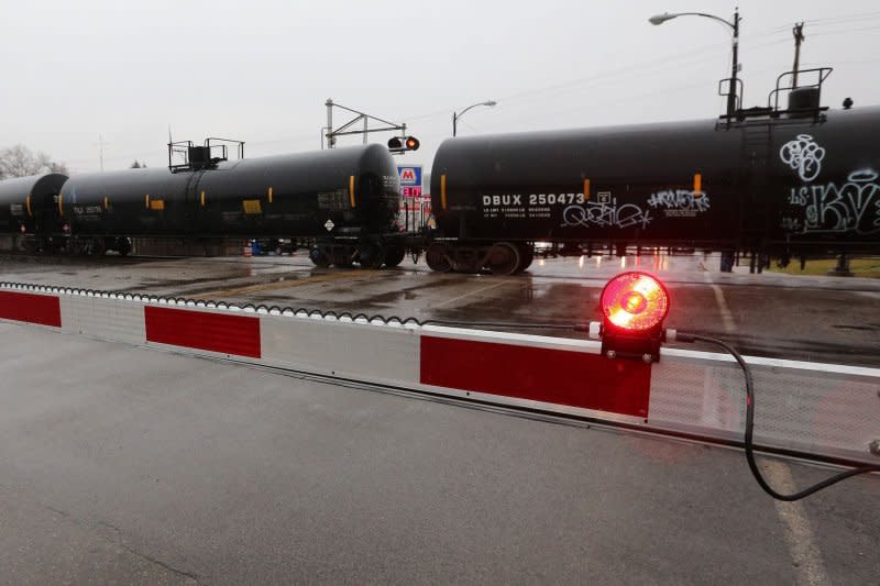 A Norfolk Southern train passes through the center of the village of East Palestine, Ohio, in February 2023. Toxic chemicals from the February 2023 East Palestine, Ohio, trail derailment near the Pennsylvania border was carried to and polluted 16 states, including parts of Canada, according to a study released Wednesday. File Photo by Aaron Josefczyk/UPI