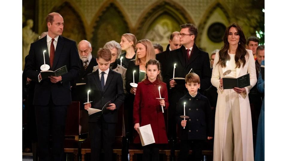 William, George, Charlotte, Louis and Kate holding candles at carol service