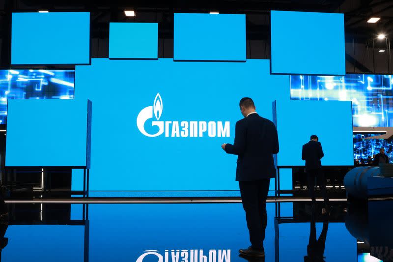 FILE PHOTO: The logo of Gazprom is displayed on a screen during the Saint Petersburg international gas forum in Saint Petersburg