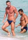 <p>Luke Evans enjoys a beach day with a friend on Tuesday in Miami.</p>