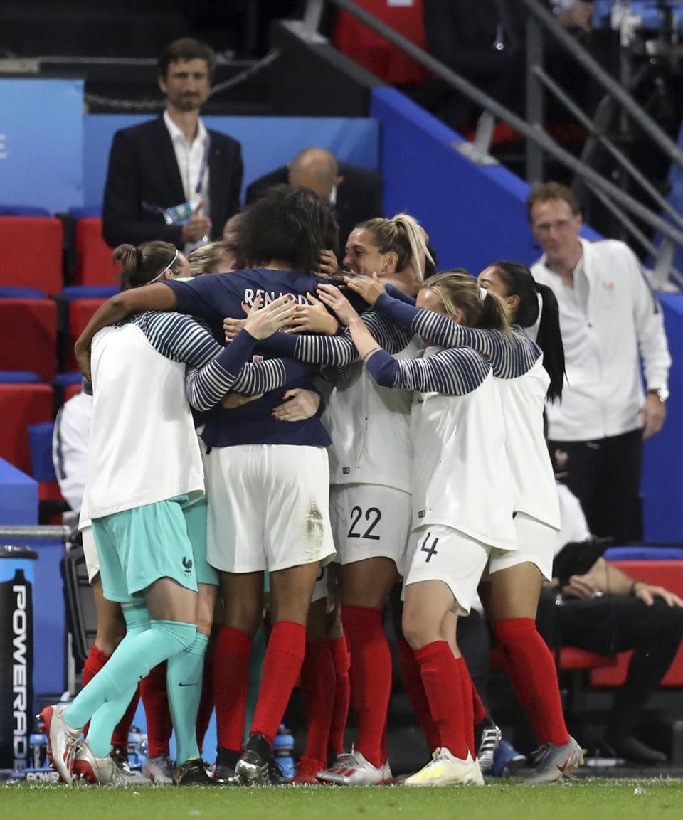 France's Wendie Renard, second from left, celebrates with teammates after scoring the opening goal during the Women's World Cup Group A soccer match between Nigeria and France at the Roazhon Park in Rennes, France, Monday, June 17, 2019. (AP Photo/Vincent Michel)