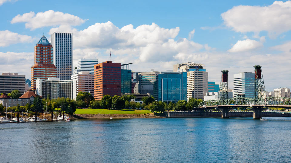Skyscrapers next to a river in Portland.
