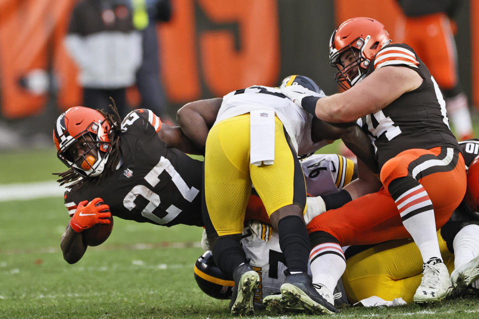 Cleveland Browns running back Kareem Hunt (27) stretches for yardage during the second half of an NFL football game against the Pittsburgh Steelers, Sunday, Jan. 3, 2021, in Cleveland. (AP Photo/Ron Schwane)