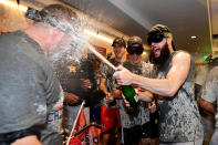 <p>Dallas Keuchel #60 of the Houston Astros celebrates with teammates in the clubhouse after defeating the Los Angeles Dodgers 5-1 in game seven to win the 2017 World Series at Dodger Stadium on November 1, 2017 in Los Angeles, California. (Photo by Harry How/Getty Images) </p>