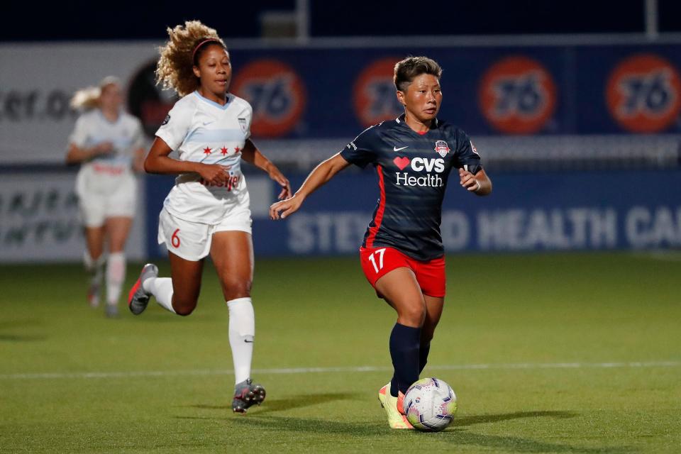 The Washington Spirit's Kumi Yokoyama, right, is chased by Chicago Red Stars Casey Short during a June 27, 2020 Challenge Cup match in Salt Lake City.