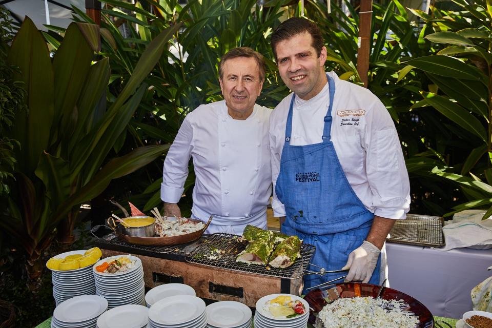 Daniel Boulud, left, poses for a photo with Cafe Boulud's present executive chef, Dieter Samijn, during a 2021 Palm Beach Food and Wine Festival event at the Palm Beach restaurant.