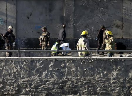 Afghan security forces inspect at the site of a suicide attack in Kabul, Afghanistan February 27, 2016. REUTERS/Mohammad Ismail