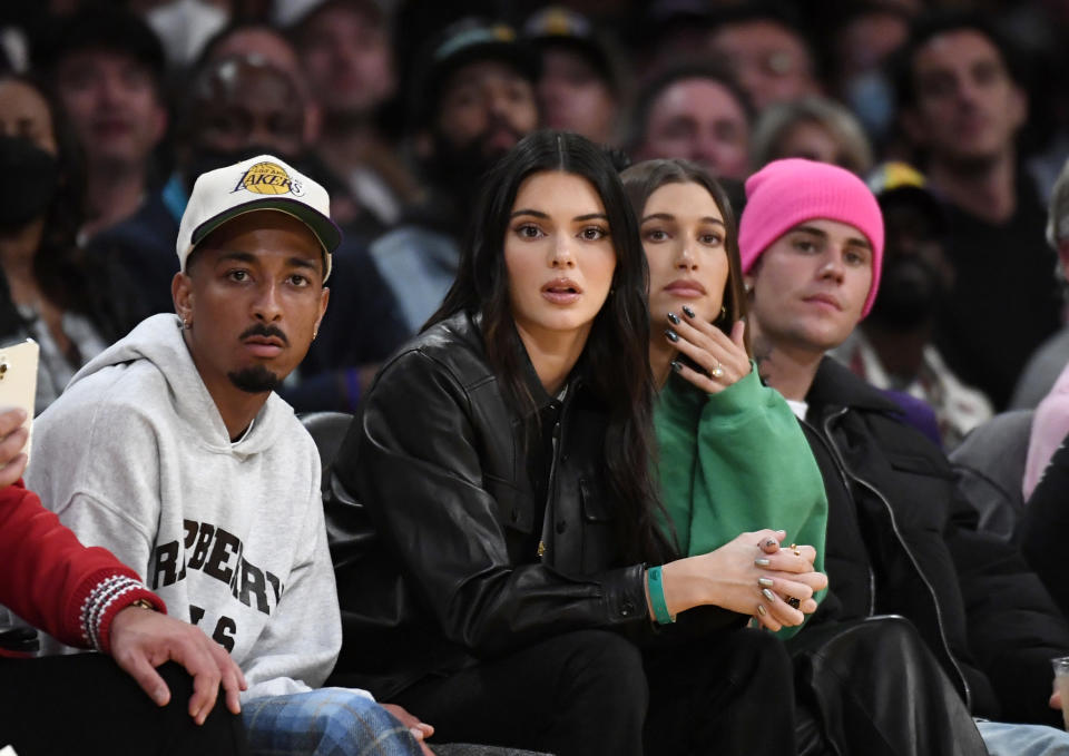 Travis Bennett, Kendall Jenner, Hailey Bieber and Justin Bieber attend the Phoenix Suns and Los Angeles Lakers baseball game at Staples Center in Los Angeles