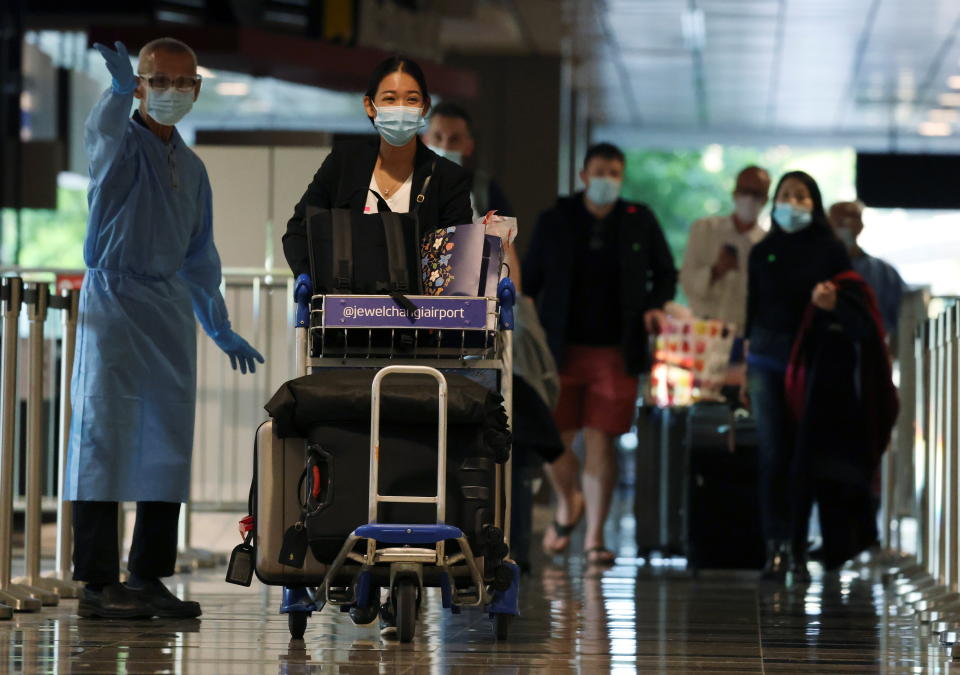 Passengers from Amsterdam arrive at Changi Airport under Singapore’s expanded Vaccinated Travel Lane (VTL) quarantine-free travel scheme as the city-state opens its borders to more countries amidst the coronavirus disease (COVID-19) pandemic, in Singapore October 20, 2021. REUTERS/Edgar Su