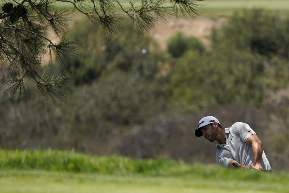 Matthew Wolff chips onto the seventh green during the first round of the U.S. Open Golf Championship, Thursday, June 17, 2021, at Torrey Pines Golf Course in San Diego. (AP Photo/Gregory Bull)