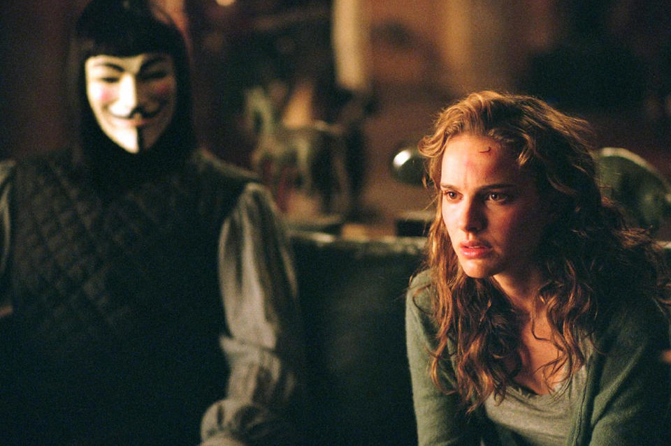 A masked man gives startling information to a female reporter in “V for Vendetta”