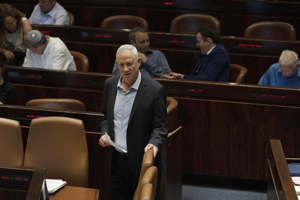Israeli Minister of Defense Benny Gantz takes his seat during a session of the Knesset, Israel's parliament, ahead of an expected vote on the legal status of Jewish settlers in the occupied West Bank, in Jerusalem, Monday, June 6, 2022. (AP Photo/ Maya Alleruzzo)