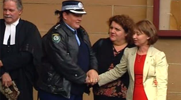 Senior Constable David Rixon's widow (far right) outside court. Photo: 7News