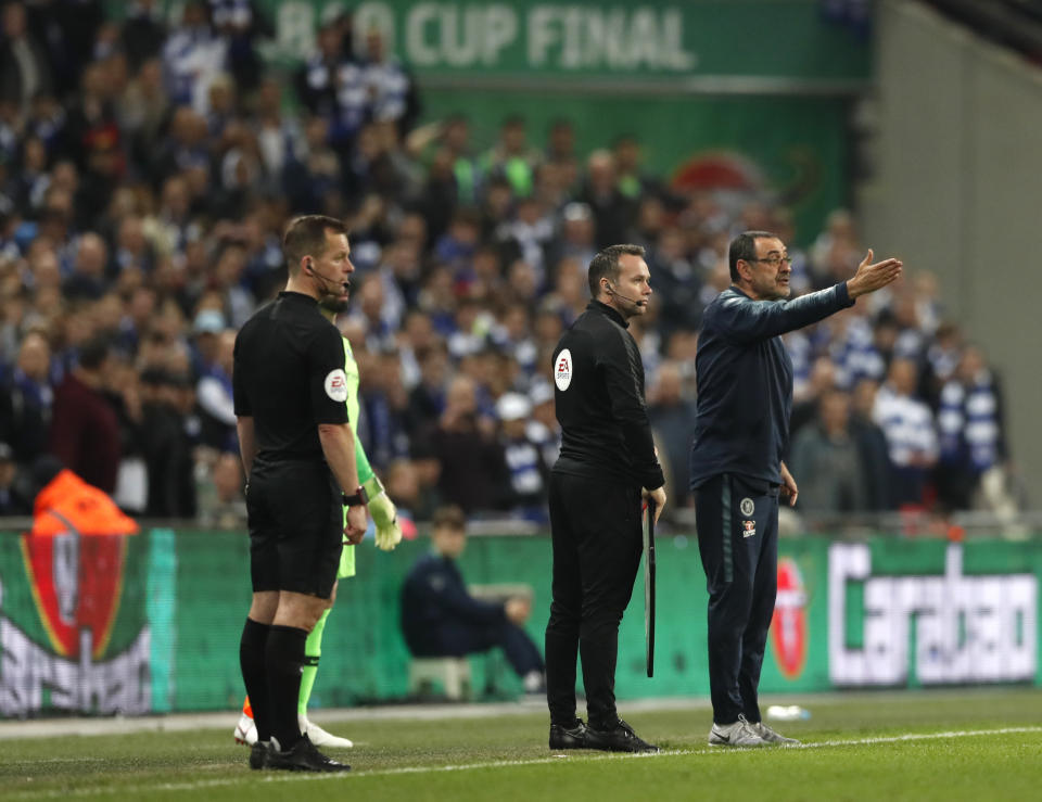 Chelsea's manager Maurizio Sarri, right, gestures during the English League Cup final soccer match between Chelsea and Manchester City at Wembley stadium in London, England, Sunday, Feb. 24, 2019. (AP Photo/Alastair Grant)