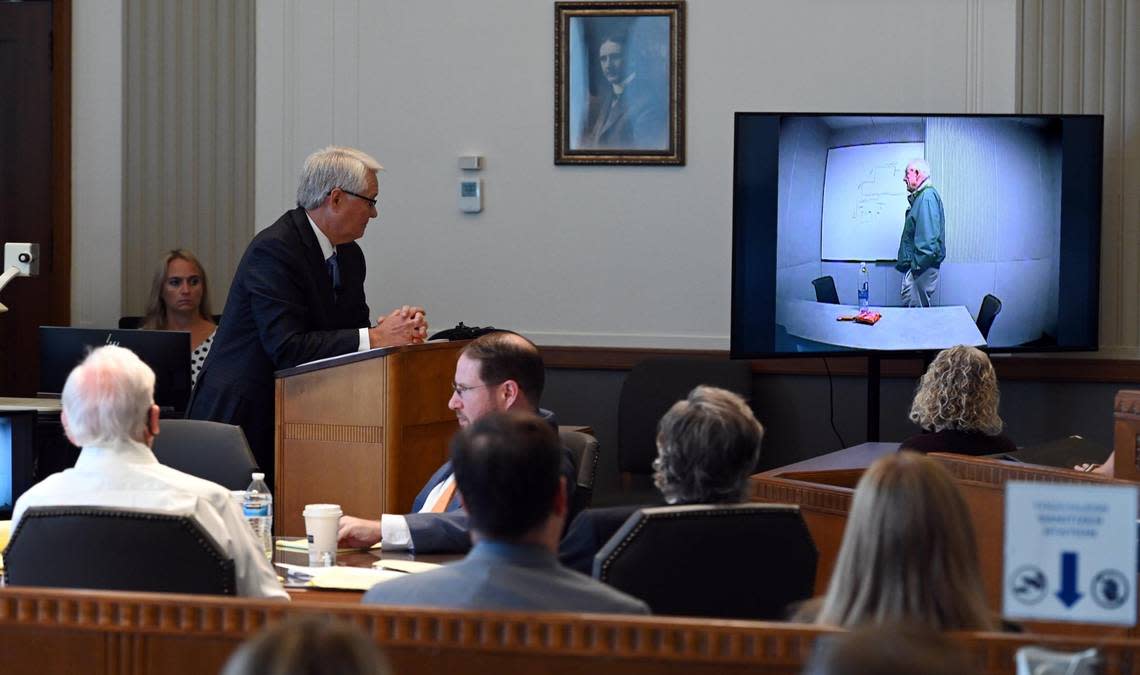 Tim Dollar, standing, gave his opening statement as the trial of 84-year-old David G. Jungerman, front left, got underway Tuesday at the Jackson County Courthouse. Dollar, who represents the Jackson County prosecutor’s office, presented a video of Jungerman talking to himself while he was alone in a police interview room.