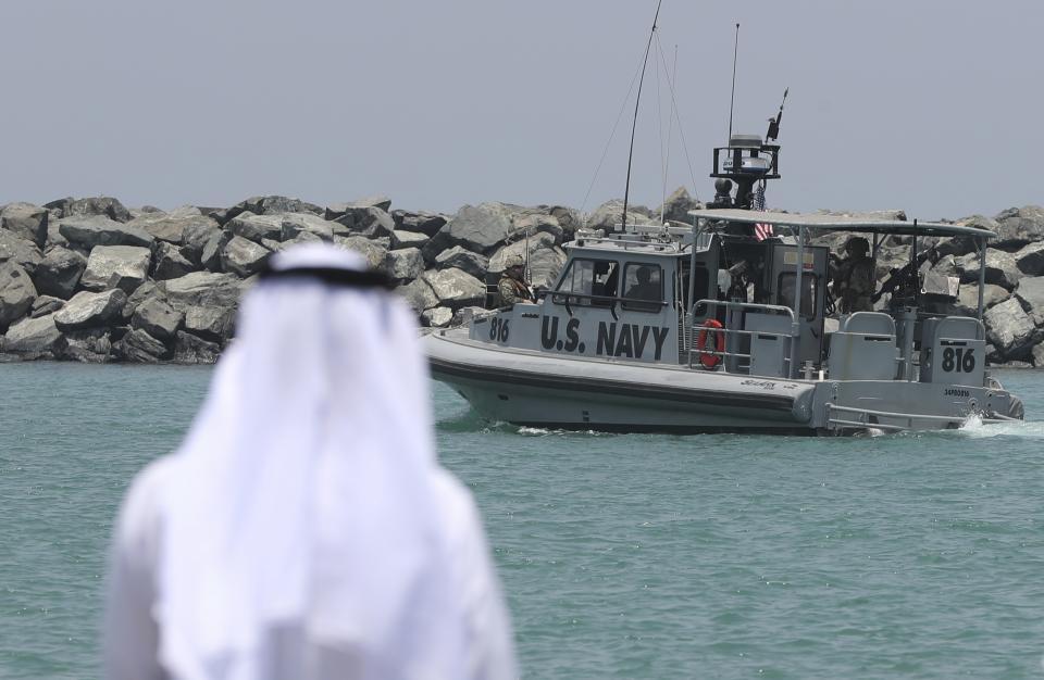 A U.S. Navy patrol boat carrying journalists to see damaged oil tankers leaves a U.S. Navy 5th Fleet base near Fujairah, United Arab Emirates, Wednesday, June 19, 2019. The limpet mines used to attack a Japanese-owned oil tanker near the Strait of Hormuz bore "a striking resemblance" to similar mines displayed by Iran, a U.S. Navy explosives expert said Wednesday. Iran has denied being involved. (AP Photo/Kamran Jebreili)