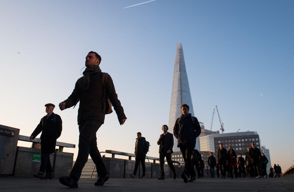 Commuters cross London Bridge, in central London, as Britain could experience more record-breaking temperatures this week.