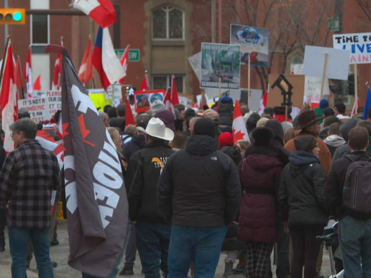 Around 1,500 people gathered at Central Memorial Park in Calgary on Saturday afternoon to protest health restrictions as a demonstration near the village of Coutts, Alta. continued. On Saturday, RCMP said it had several open investigations underway related to the Coutts border protest. (Helen Pike/CBC - image credit)