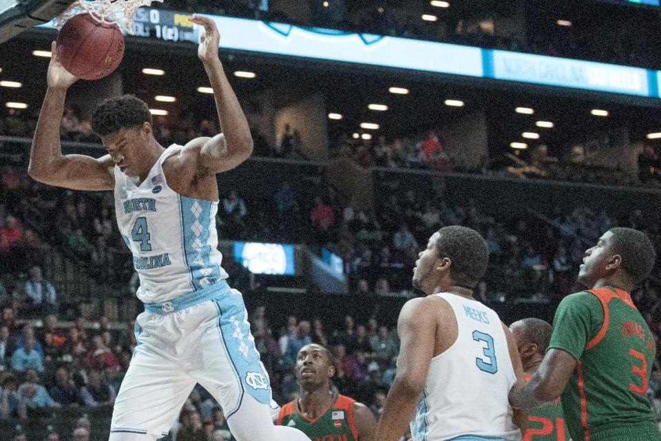 North Carolina forward Isaiah Hicks (4) dunks during the second half of an NCAA college basketball game against the Miami in the Atlantic Coast Conference tournament, Thursday, March 9, 2017, in New York. North Carolina won 78-53. (AP Photo/Mary Altaffer)