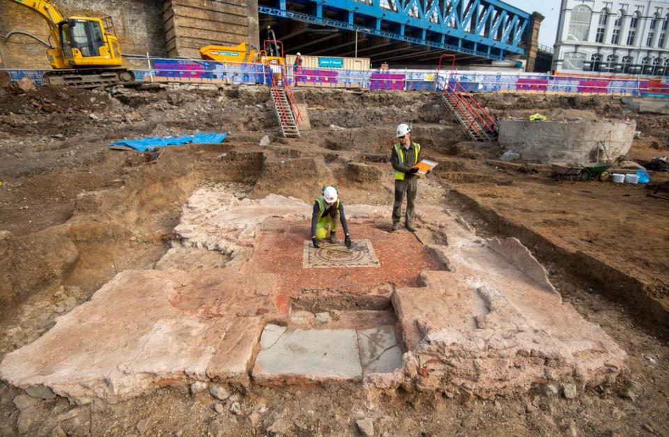 Archaeologists study the mausoleum soon after uncovering the ruins.