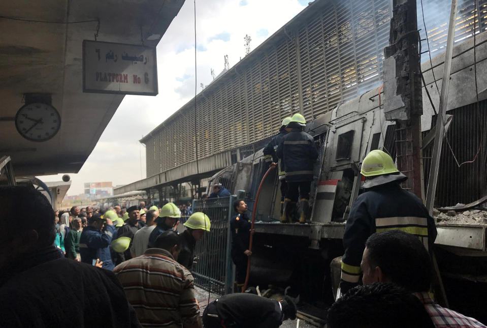 Rescue workers assess the damage to the train after the crash in the Egyptian capital. (REUTERS/Amr Abdallah Dalsh)