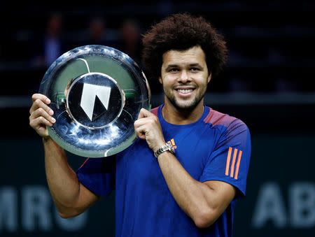 Tennis - ABN AMRO tournament - Men's Singles' final - Ahoy Stadion, Rotterdam - 19/02/17 Jo-Wilfried Tsonga of France celebrates with the trophy after winning his match against David Goffin of Belgium REUTERS/Michael Kooren