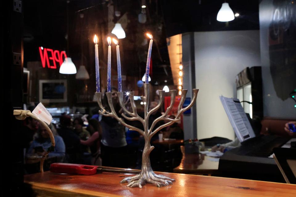 A menorah sits on a window sill during the 2022 "Totally Lit! A Hanukkah Celebration!" at Gili's Kitchen. This year's festivities are at James Weldon Johnson Park.