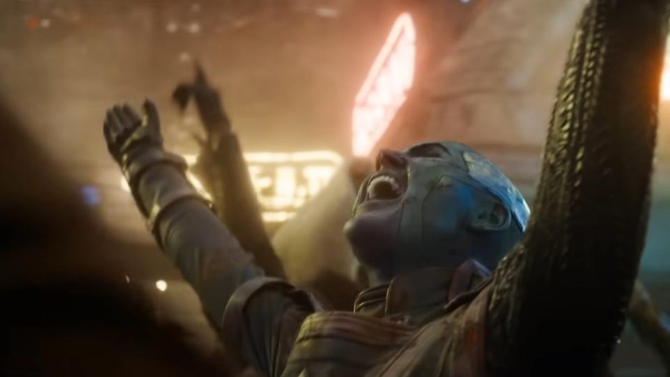 Nebula screams in joy with her hands raised over her head in triumphant in Guardians of the Galaxy Vol. 3