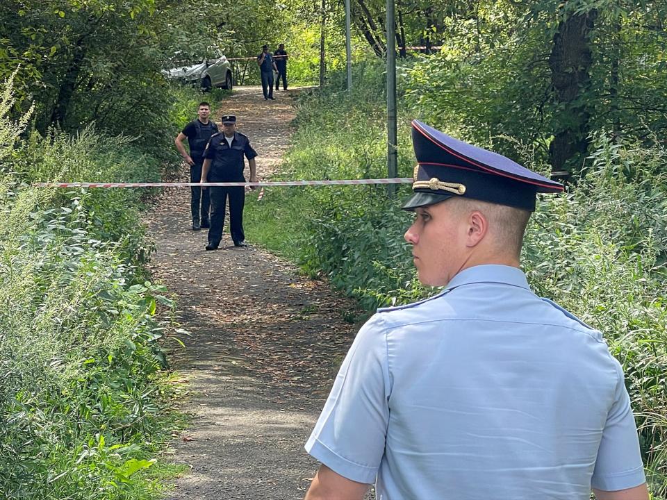 Russian law enforcement officers gather near the accident scene following a reported Ukrainian drone crash in Moscow, Russia, August 11, 2023. (REUTERS)