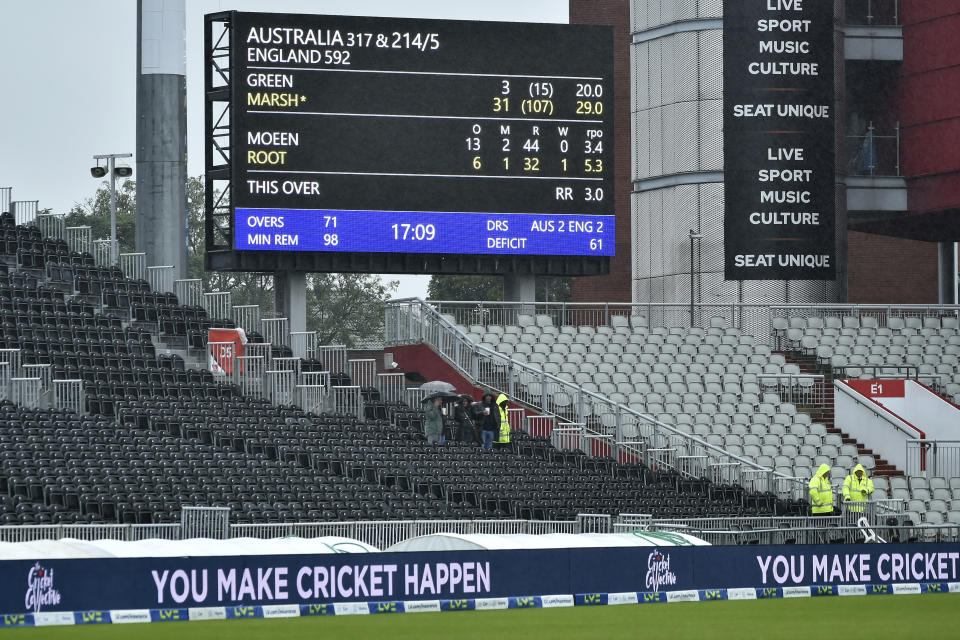 View at the scoreboard as rain continues during the fifth day of the fourth Ashes Test match between England and Australia at Old Trafford, Manchester, England, Sunday, July 23, 2023. (AP Photo/Rui Vieira)