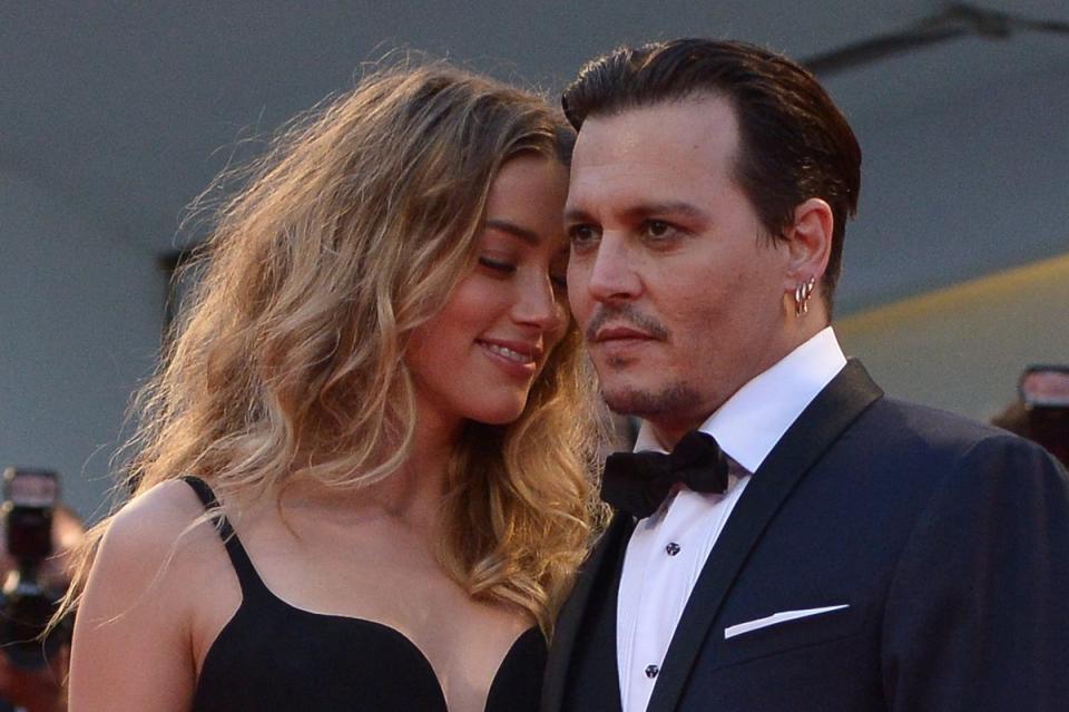 Depp, pictured with his then wife Amber Heard  in 2015, defeated the actress in a  contentious defamation trial last year (AFP via Getty Images)