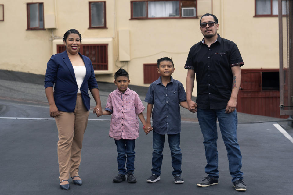 Antonio Valle, from right, two sons, Gohan and Seiya, and wife, Brenda, stand for a photo after an interview with The Associated Press in Los Angeles, Tuesday, June 18, 2024. The couple were both born in Mexico. Antonio Valle has been a U.S. citizen since 2001. Brenda Valle came to the U.S. with her family when she was 3 years old and will now be eligible for legal status under Biden's new plan. She is a DACA recipient and has worried every two years whether it would get renewed. Their sons are U.S. citizens. (AP Photo/Jae C. Hong)