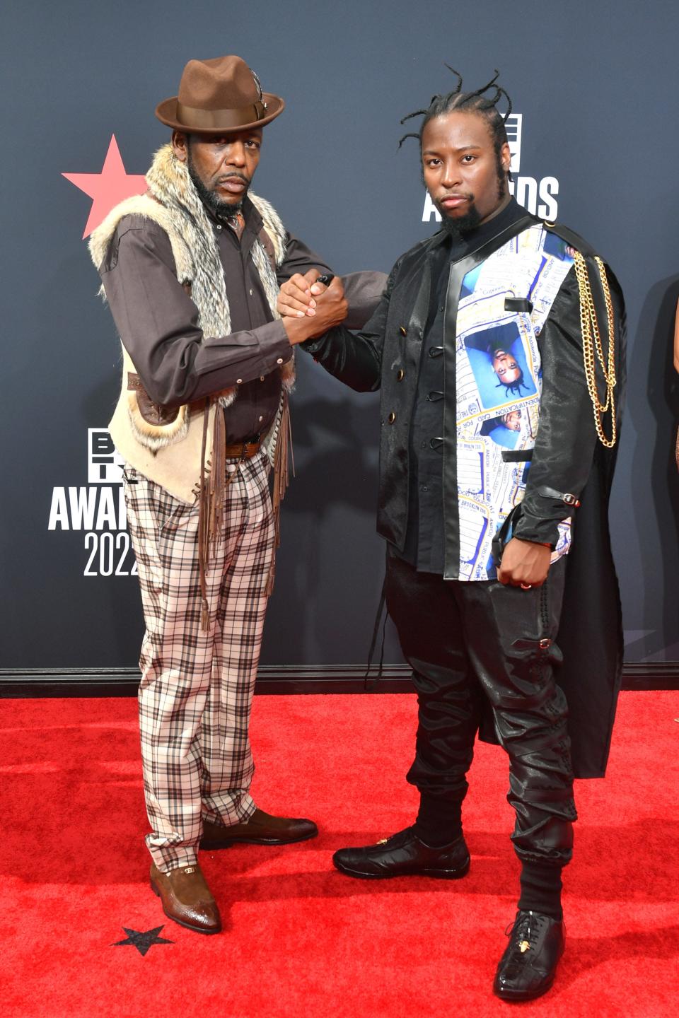 Young Dirty Bastard and a guest attend the 2022 BET Awards in Los Angeles, California.