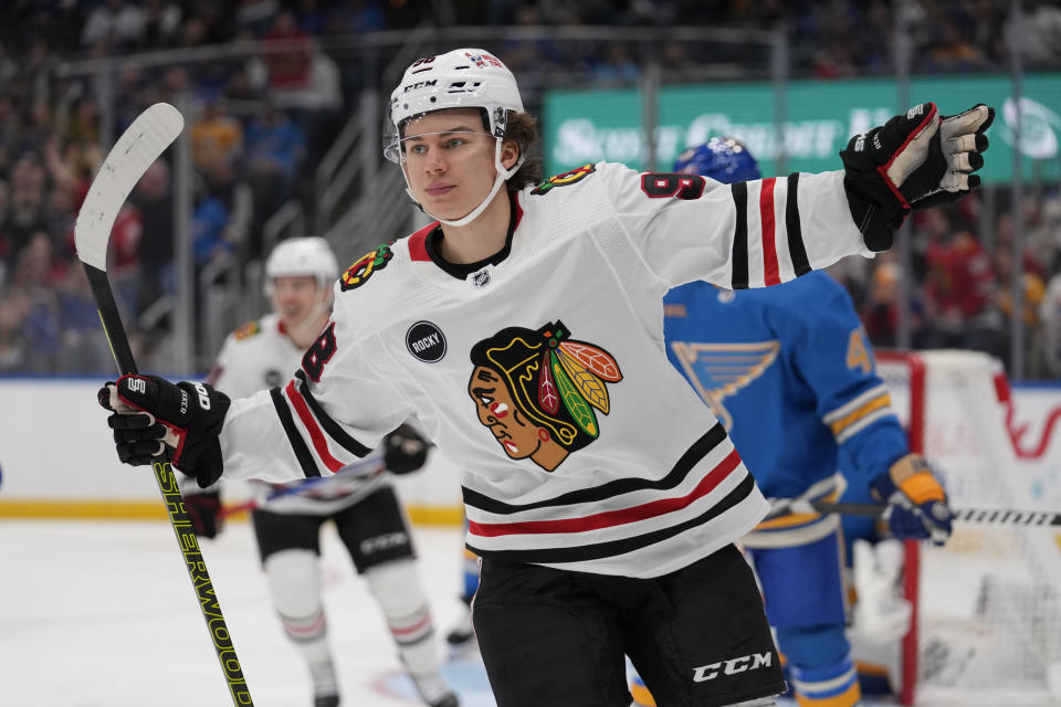 Chicago Blackhawks' Connor Bedard celebrates after scoring during the first period of an NHL hockey game against the St. Louis Blues Saturday, Dec. 23, 2023, in St. Louis. (AP Photo/Jeff Roberson)