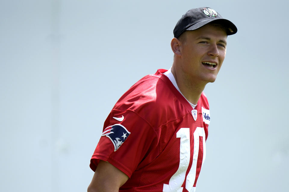 New England Patriots quarterback Mac Jones steps on the field before the start of an NFL football team practice, in Foxborough, Mass., Monday, May 23, 2022. (AP Photo/Steven Senne)