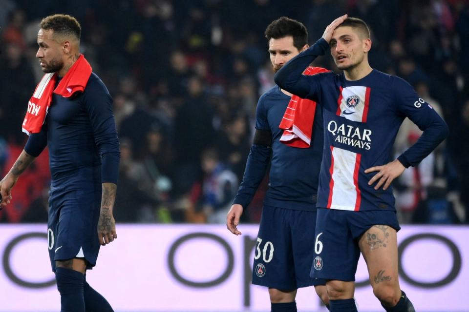 PSG players react at full-time following the defeat (AFP via Getty Images)