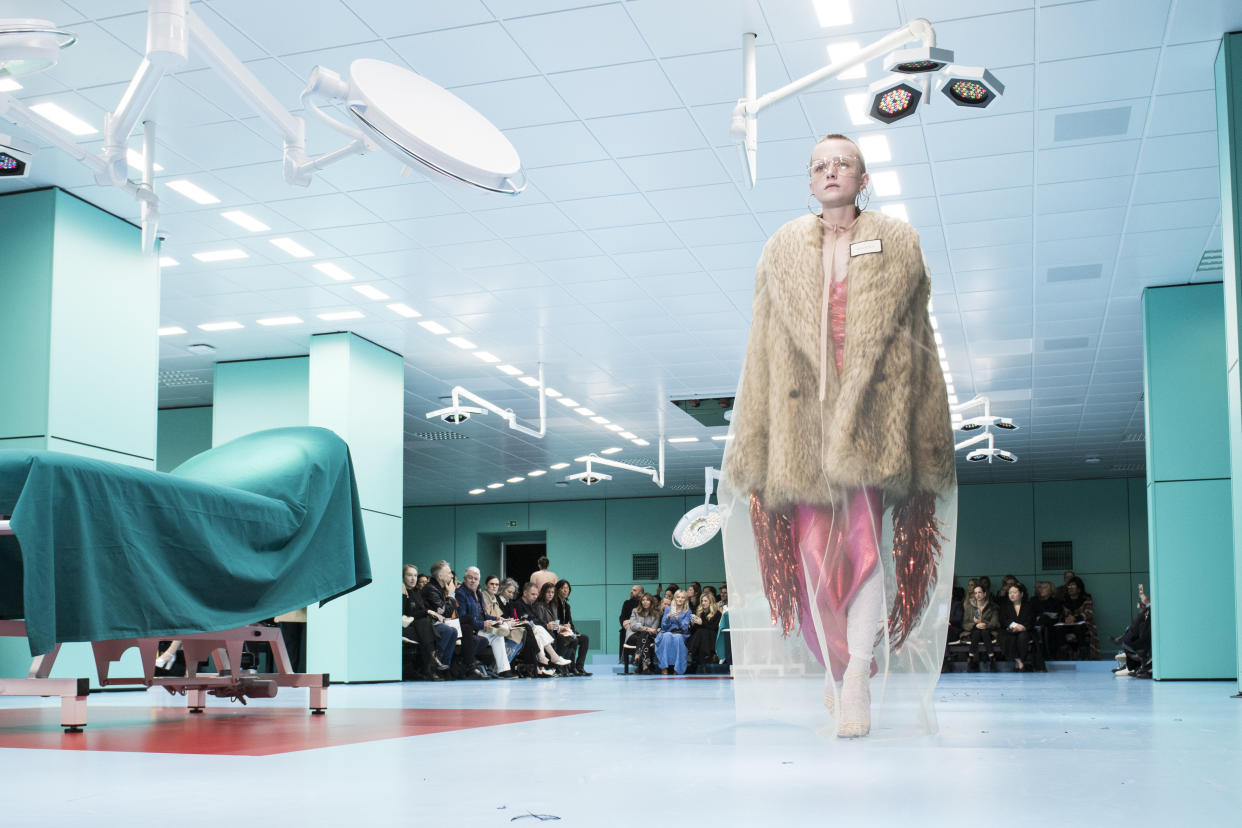 A model wears a faux fur coat on the runway at Gucci's fall/winter 2018 show.  (Pietro D'aprano via Getty Images)