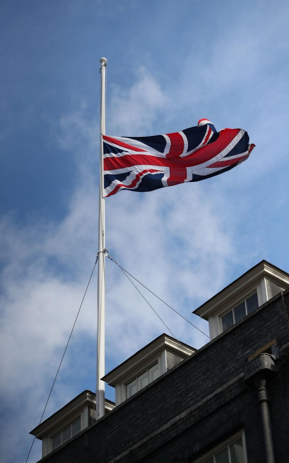 The Union flag is flown at half mast in Downing Street - Credit: Andrew Matthews/PA Wire