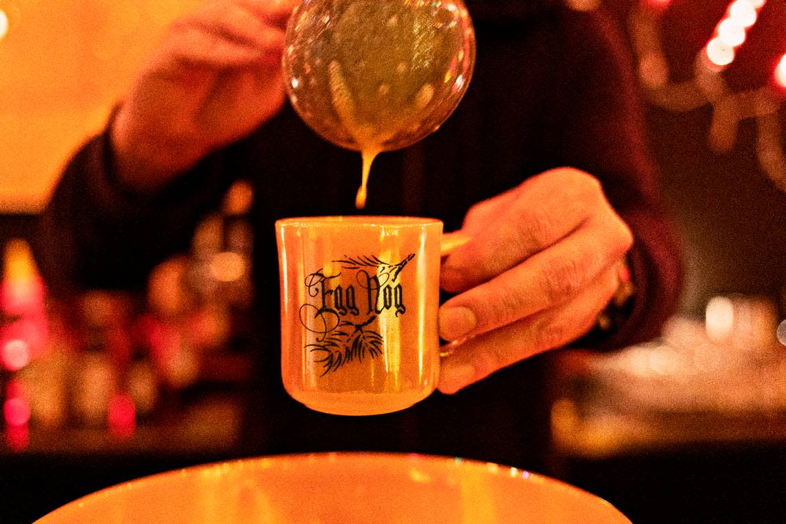 Justin Sykes, beverage director and manager at Jack Tar Restaurant & Lounge in Durham, pours a one-year eggnog at the bar on Monday, Nov, 22, 2021.