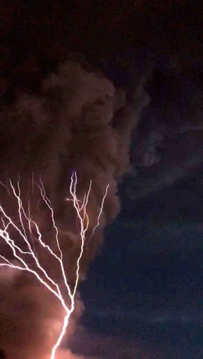 Forks of lighting were seen alongside the spewing ash of the Taal volcano in the Philippines (Picture: SWNS)