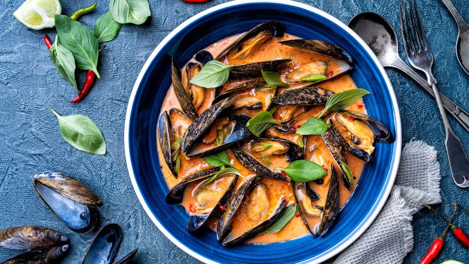 Blue mussels are featured in a spicy thai red curry sauce. Mussels are a low-fat, low-calorie source of protein that are rich in omega-3 fatty acids. - Fudio/iStockphoto/Getty Images